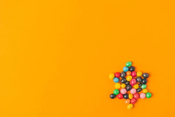 Top view of star made of sweets isolated on orange, purim holiday concept — Stock Photo