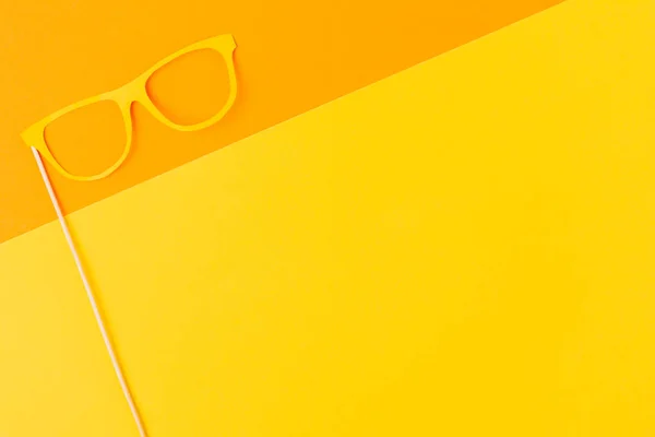 Top view of masquerade mask on yellow and orange background — Stock Photo