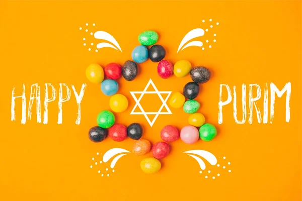 Top view of star made of sweets isolated on orange, purim holiday concept — Stock Photo
