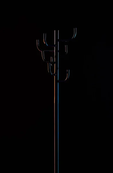 Empty coat rack isolated on black — Stock Photo