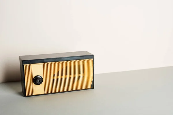 Retro radio on grey surface and white background — Stock Photo