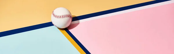 Baseball with shadow on colorful background with lines, panoramic shot — Stock Photo
