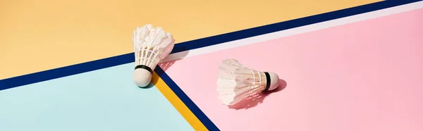 Badminton shuttlecocks on abstract background with blue lines, panoramic shot — Stock Photo