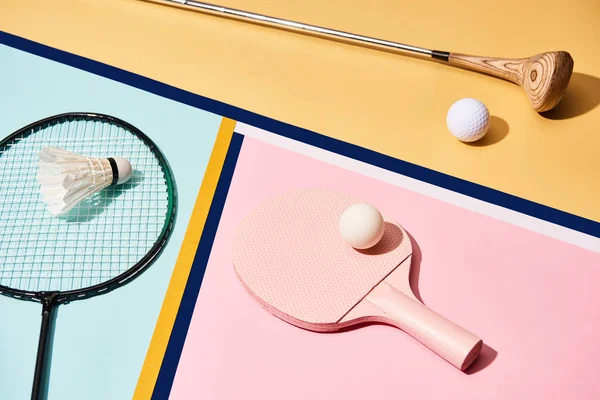 Equipment for badminton, golf and table tennis on colorful background with lines — Stock Photo