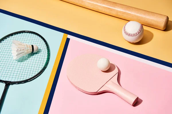 Sets for badminton, table tennis and baseball on colorful background with lines — Stock Photo