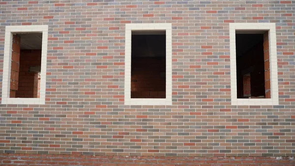 Facade of a brick house. windowless brick building