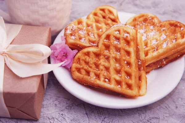 Heart Shaped Waffles for Breakfast with Gift Box on table with Little Pink flower, View from above — Stok Foto