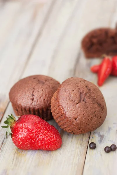 Chocolate Muffins with Strawberry Mint Leaves over rustic Gray Background Breakfast desert — Stock Photo, Image