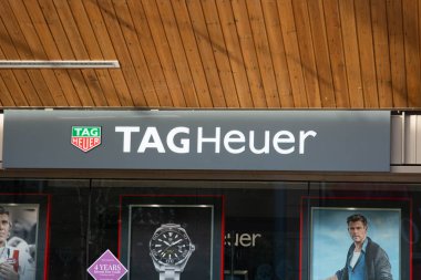 Rushden, Northamptonshire, United Kingdom - 15 November 2019 - Shopping center in Rushden. TAG Heuer storefront. Swiss manufacturer of sports watches and precision chronographs. clipart