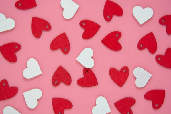 Valentine's day pink background with red hearts pattern, flat lay. Birthday, party love. — ストック写真