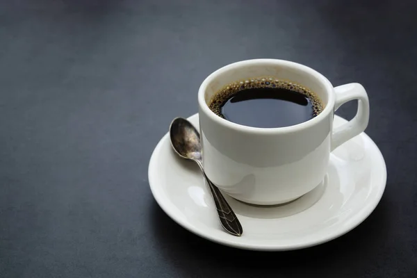 Coffee cup isolated. White cup of coffee top view spoon and plate on dark background — 스톡 사진