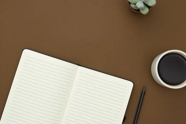 Table top of work desk. Open blank white notebook, pencil and cup of coffee on the desk, table top, working space with copy space. — Stock Photo, Image