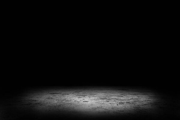 Abstract image of Studio dark room concrete floor texture background with spotlight.