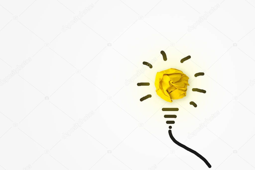 Business Creative Idea Concept : Yellow crumpled paper ball light bulb bright growing on white background.