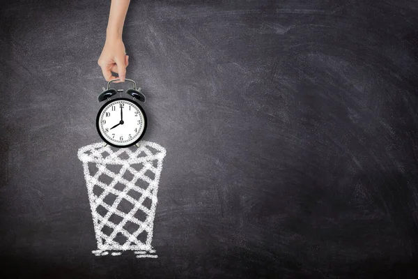 Time Management Concept Female Hand Holding Black Alarm Clock Throwing — Stockfoto