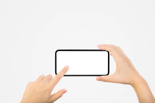 ビジネスコミュニケーションコンセプト 灰色の背景を持つ古い黒のスマートフォンを手で握る — ストック写真