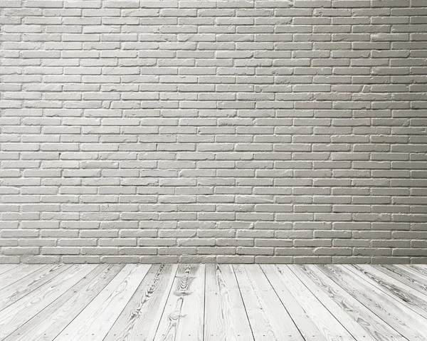 Empty space of Studio room of white brick wall and wooden floor.