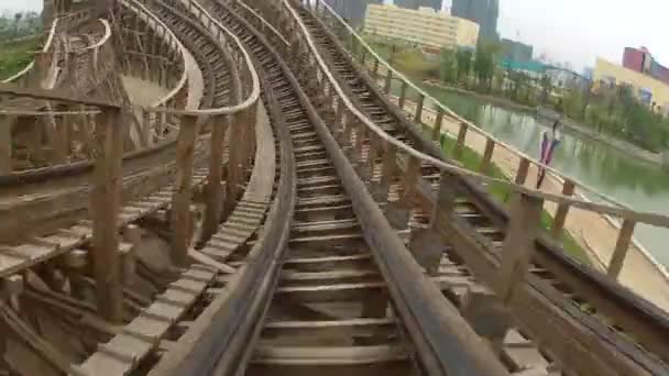 Flying through turns on wooden roller coaster — Stock Video