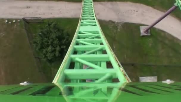 Green and purple roller coaster — Stock Video