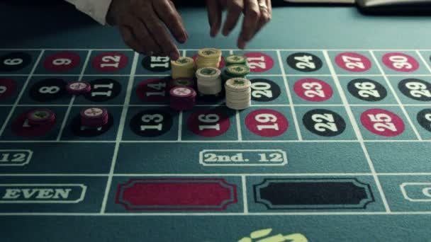 Stacking chips onto a roulette table — Stock Video