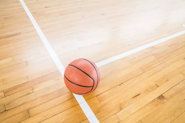 Basketball ball over floor