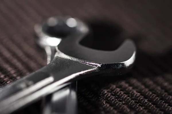 Wrench on wooden table — Stock Photo, Image