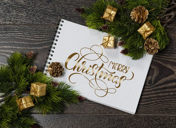 Background of tree branches and space for greetings with text Merry Christmas. Calligraphy lettering — Stock Photo, Image