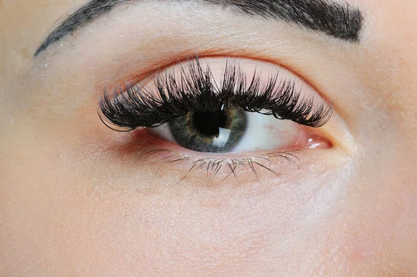 Olhos de mulher e pestanas. maquiagem close-up — Fotografia de Stock