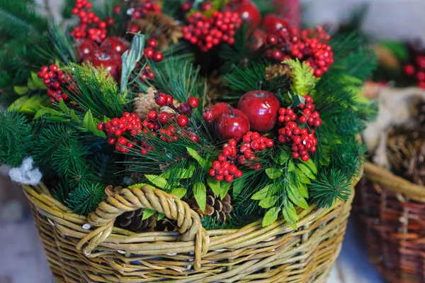 Christmas Decor basket with fir branches and apples — Stock Photo, Image