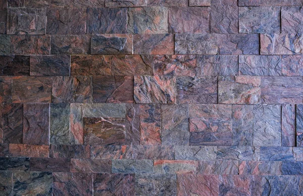 Getextureerde muur gemaakt van granieten stenen achtergrond — Stockfoto