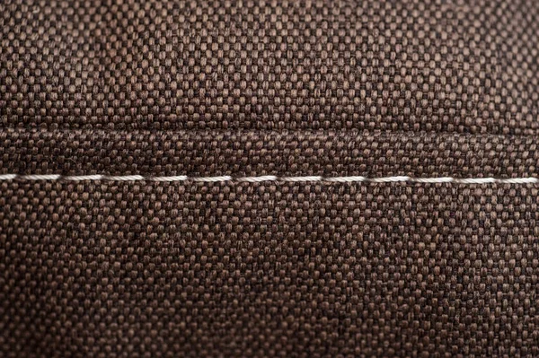 Textura de tecido marrom com costura branca — Fotografia de Stock