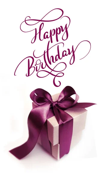 Gift boxes with brown bow on a white background and text Happy Birthday. Calligraphy lettering — Stock Photo, Image
