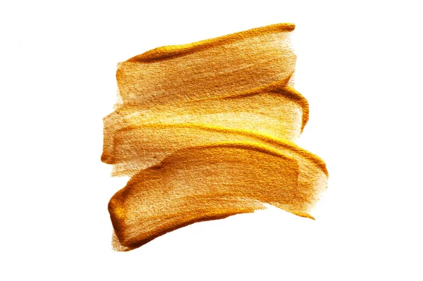 Kağıt üzerinde altın rengi boya ile soyut fırça darbeleri — Stok fotoğraf