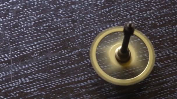 Spinning whirligig on the table. Slow Motion — Stock Video