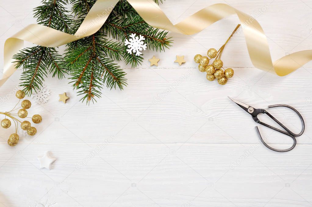 Mockup Christmas decor top view and gold ribbon, flatlay on a white wooden background, with place for your text