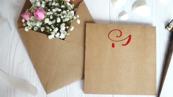 I Love You Vintage Written animation text on kraft envelope on white wooden background. Calligraphy and lettering flourish elements for Valentines Day wedding or other holidays Royalty Free Stock Footage