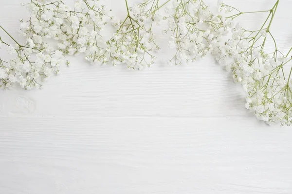 Mock up Composition of white flowers rustic style, for St. Valentines Day with a place for your text. Flat lay, top view photo mock up