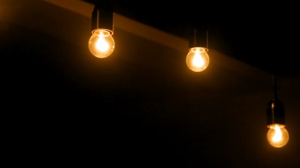 Dark interior room with light bulbs — Stock Video