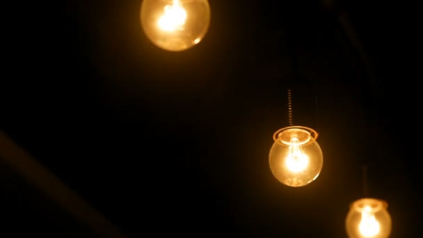 Dark interior room with light bulbs — Stock Video