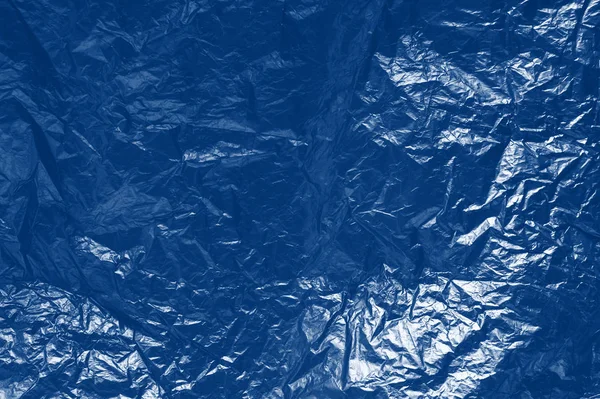 Background of crumpled paper. Classic blue toning trend 2020 year color — Stock Photo, Image