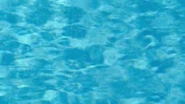Pure blue water in the pool with light reflections. 4k video motion 3840x2160