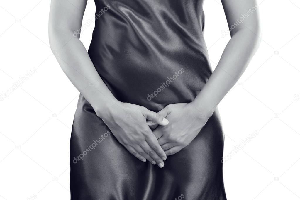 Woman with hands holding pressing her crotch lower abdomen. Medi