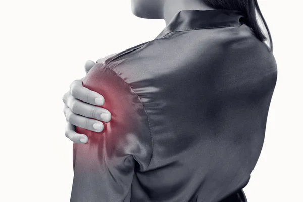 Young woman suffering from pain in shoulder — Stock Photo, Image