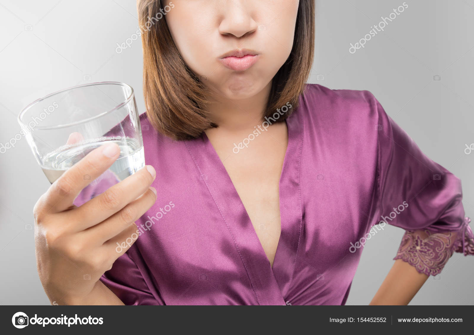 Asian women are mouthwash after brushing teeth — Stock Photo © Tharakorn 154452552