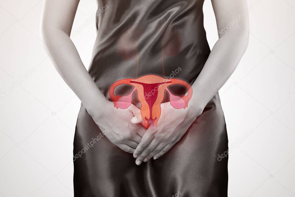 Woman with hands holding her crotch. Female anatomy concept.