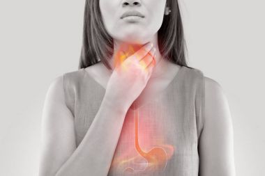 Woman Suffering From Acid Reflux Or Heartburn clipart
