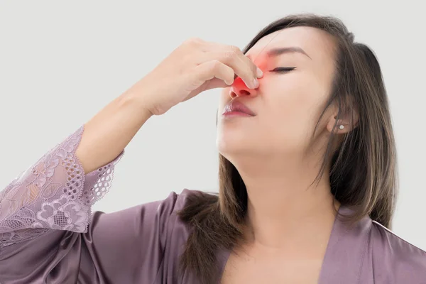 Asian women in satin nightwear with nosebleed. — Stock Photo, Image