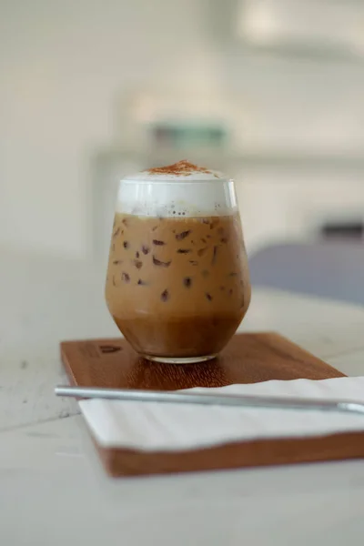 Iced coffee with straw in plastic cup — Stock Photo, Image