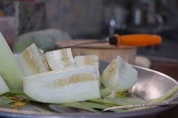 Cutting winter melon on chopping board prepare for cooking thai food