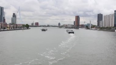 Rotterdam Netherlands August 2018 sea River view from the bridge moving cargo ships with amazing weather and cloud in the sky